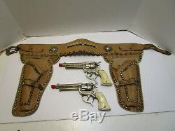 1950's LESLIE HENRY GENE AUTRY CHAMPION CAP GUNS WithSTUDDED LEATHER HOLSTER
