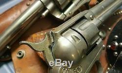 2 Hubley Nickel Cowboy Cap Guns With Leather Holsters And Spurs