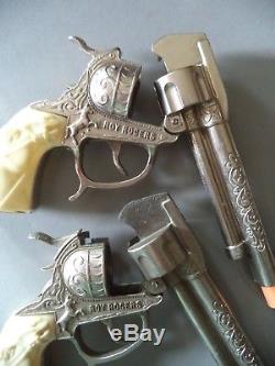 2 Roy Rogers 9 Leslie Henry cap guns white horse grips 1 is a smoker Excellent
