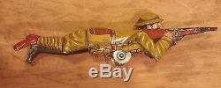 Antique Marx tin lithograph wind up crawling soldier toy with gun