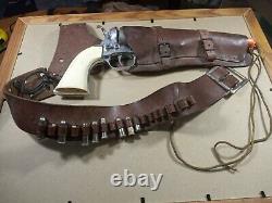Hubley Colt 45 Brass Cylinder Cap Gun & 18 Blank Holster with 8 Blanks currently