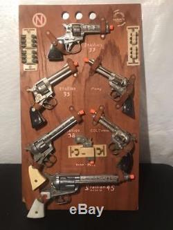 Huge c. 1960 Nichols Full Dealer's Display Sales Board with all 7 Cap Gun Pistols