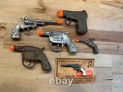 LOT OF 6 ANTIQUE CAP GUNS SOME GOING BACK TO 1920s ALL FIRE GREAT LOT