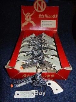 Nichols Stallion 22 Counter Display. 12 Mint Guns, All have Mint 2 pc toy Bullets