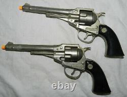 Pair of vintage Hubley Remington. 36 Cap Guns with Leather The Texan Holsters
