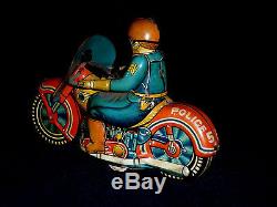 VINTAGE 1950s EARLY JAPAN TINPLATE POLICE MOTORCYCLE RIDER WITH MACHINE GUN