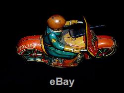 VINTAGE 1950s EARLY JAPAN TINPLATE POLICE MOTORCYCLE RIDER WITH MACHINE GUN