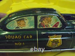 Vintage Friction Dick Tracy Squad Car No. 1 with machine gun out windshield