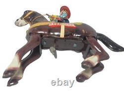 Vintage HAJI Cow Boy/ Gun Wind Up Litho Tin Toy Jumping Horse Made In Japan
