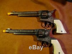 Vintage Halco Dbl. Holster set with two matching bronze finish cap guns 1955-60