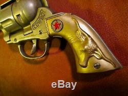 Vintage Western Toy Cap Gun called The Cowboy with jeweled studded holster