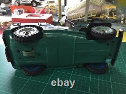 Vintage tinplate friction large army jeep with a gun on the back made in japan